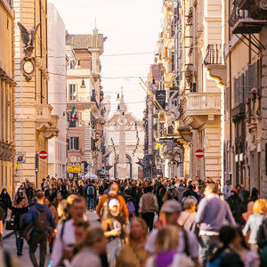Crowds of people on Via Del Corso shopping street in Rome, Italy