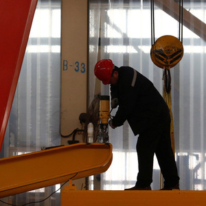 A man works in the Tianye Tolian Heavy Industry Co. factory in Qinhuangdao