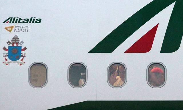 Pope Francis waves through window of airplane at the Sarajevo airport