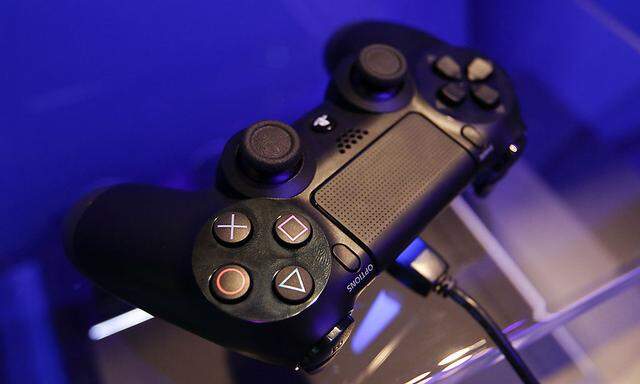 A controller of a Playstation 4 is pictured at the Sony exhibition stand during the Gamescom 2013 video games trade fair in Cologne