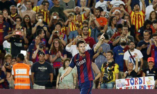 FC Barcelona's Messi celebrates his goal during the Spanish first division soccer match against Elche at Nou Camp stadium in Barcelona