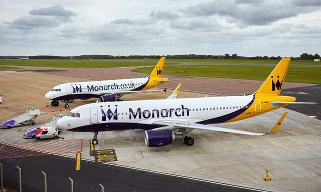 October 2 2017 Luton BEDFORDSHIRE UK LUTON UK Two Airbus A320 aircraft belonging to Monarch