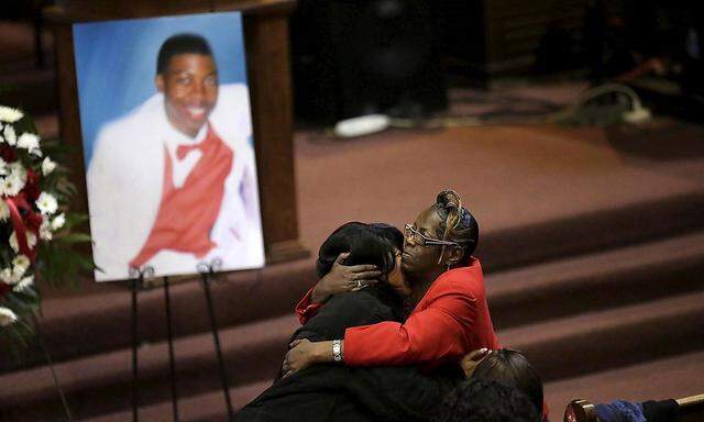 Janet Cooksey, is embraced as she attends the funeral for her son Quintonio LeGrier in Chicago