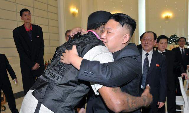 North Korean leader Kim Jong-Un and former NBA basketball player Dennis Rodman hug in Pyongyang