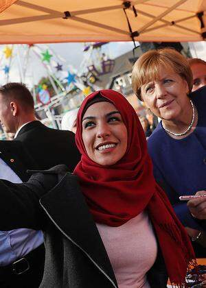Merkel Visits Local Fest In Stralsund