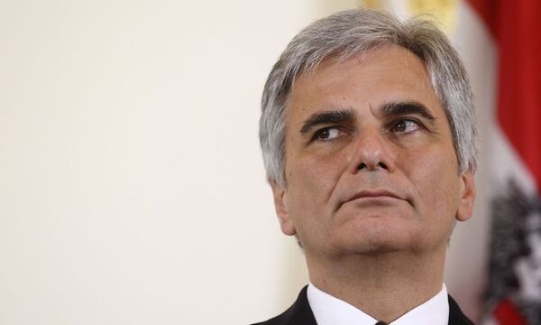 Austrian Chancellor Faymann of the Social Democrats SPOe listens during a news conference after  cabinet meeting in Vienna
