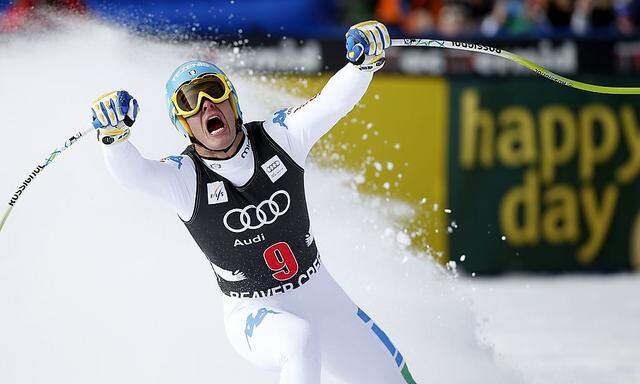 Christof Innerhofer of Italy celebrates setting the best time as he skis into the finish area in men's World Cup downhill ski race in Beaver Creek