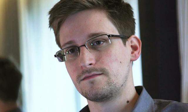 File photo of NSA whistleblower Edward Snowden in his hotel room in Hong Kong