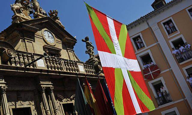 The Basque flag ´Ikurrina´ is draped in front of the town hall at the start of the San Fermin Festival in Pamplona