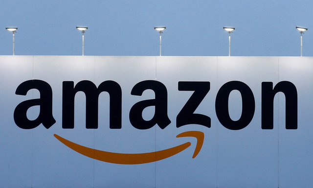 FILE PHOTO - The logo of Amazon is seen at the company logistics center in Lauwin-Planque northern France