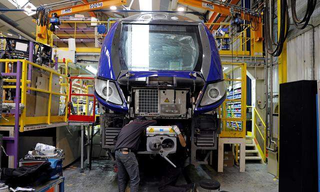 An employee works on a new regional transport train at the Bombardier plant in Crespin, near Valenciennes