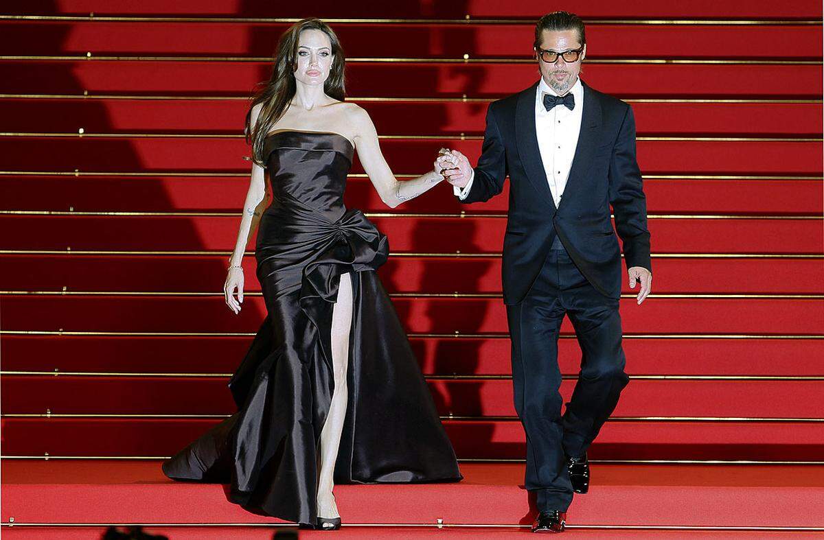 Mit diesem schicken Paar erreichte das Festival einen Höhepunkt: Brad Pitt und seine Lebensgefährtin Angelina Jolie (in Versace) vor dem Screening von Terrence Malicks "The Tree of Life".