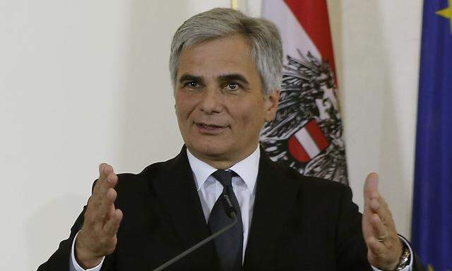 Faymann addresses a news conference in Vienna