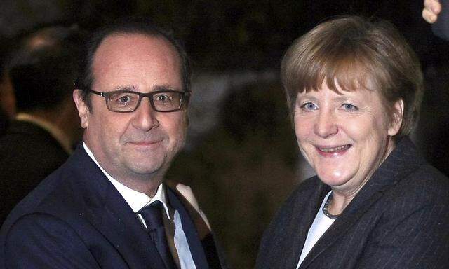 Hollande mit Merkel.