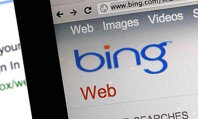 A photo illustration shows the websites of search engines Baidu and Bing on computer screens in Shang