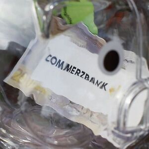 File photo of Commerzbank logo inside a transparent plastic piggy bank