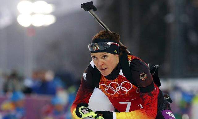 File picture shows Germany's Sachenbacher-Stehle leaving shooting range during mixed biathlon relay at 2014 Sochi Olympic Games