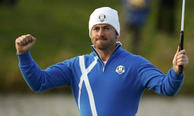 European Ryder Cup player Graeme McDowell celebrates after winning his foursomes 40th Ryder Cup match at Gleneagles