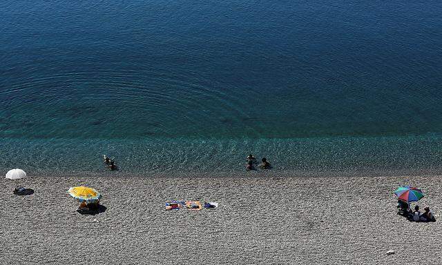 Tourists enjoy a beach in the Mediterranean resort city of Antalya