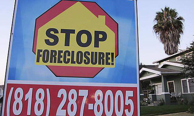 FILE - In this file photo taken Aug. 8, 2010, a foreclosure sign is posted outside a home in Los Ange