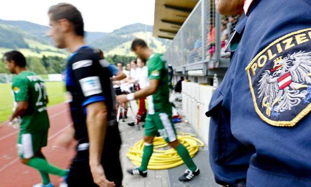 A police officer stands guard during a friendly soccer match between Israel's Maccabi Haifa and Germany's SC Paderborn in the Austrian village of Leogang