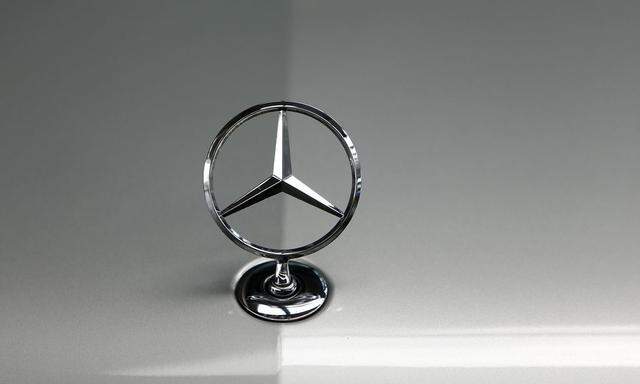 File photo of bonnet emblem of Mercedes-Benz car in dealership of German car manufacturer Daimler in Munich