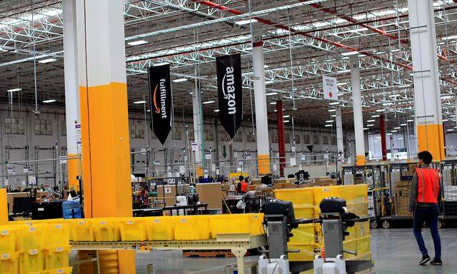 An employee is seen at the new Amazon warehouse during its opening announcement on the outskirts of Mexico City