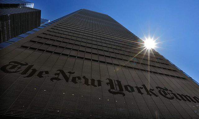 The sun peaks over the New York Times Building in New York in this file photo
