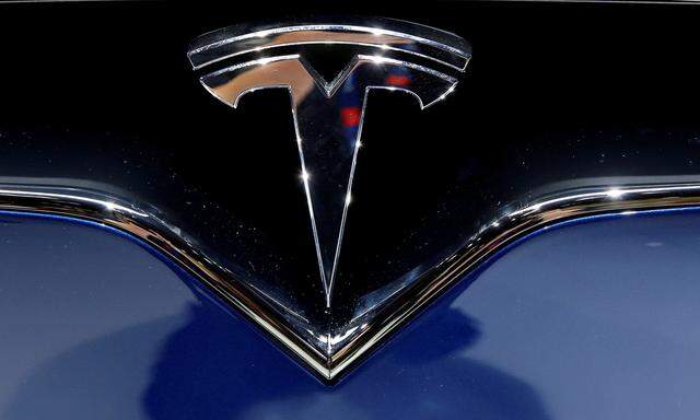 A Tesla logo is seen on media day at the Paris auto show, in Paris