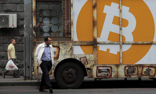 FILE PHOTO: A board with the logo of Bitcoin is on display in Yerevan
