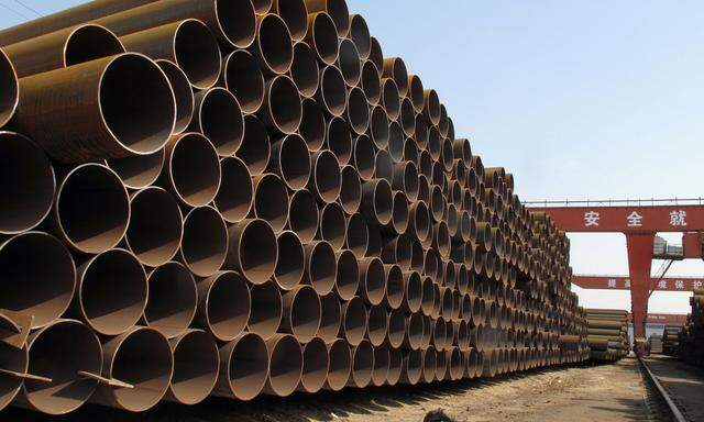 Steel pipes waiting to be loaded and transferred to the port are seen at a steel mill in Cangzhou