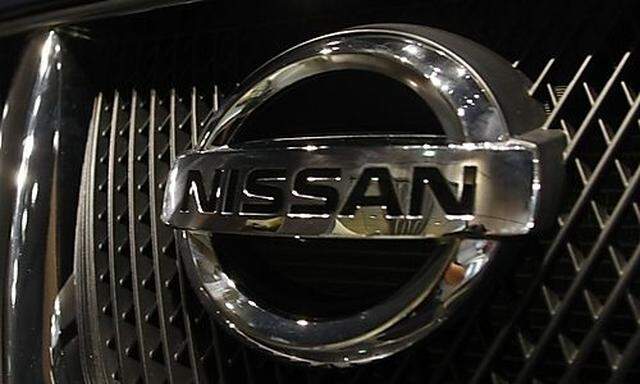 Visitors look at Nissan Murano SUV at a showroom in Tokyo