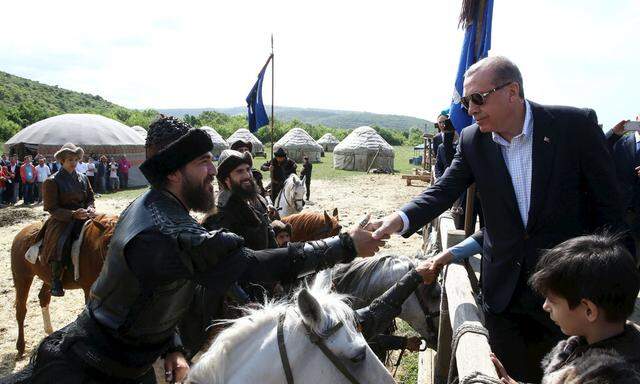 Turkish President Erdogan shakes hands with actors during a visit  to the set of the TV series ´Dirilis´ in Istanbul, Turkey