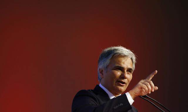 Austrian Chancellor Faymann delivers his speech at a Social Democrats party meeting in Vienna