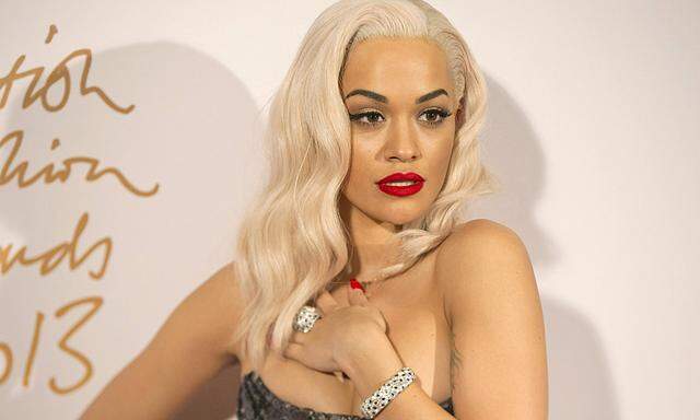 British singer Rita Ora poses for photographs at the British Fashion Awards in London
