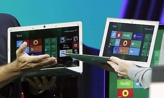 Microsoft Windows President Sinofsky with Vice President Angiulo introduce laptops in development tha