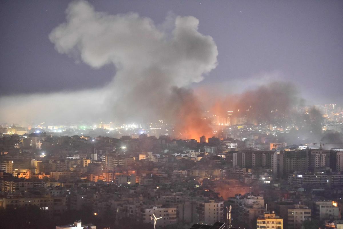 Smoke rises after the Israeli air strike on a Beirut neighborhood