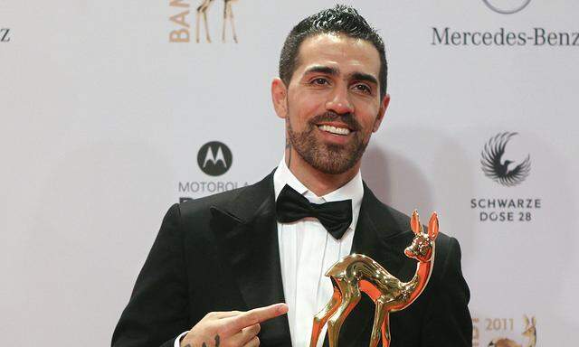 German musician Bushido poses with the trophy for Integration during the 63rd Bambi media awards ceremony in Wiesbaden