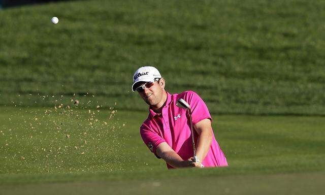 Wiesberger of Austria strikes the ball from the bunker number 10 in the second round of the Dubai Desert Classic