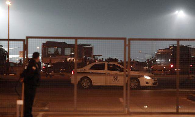 A police car drives on the tarmac of Sabiha Gokcen airport in Istanbul