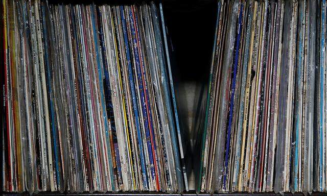 Seven-inch vinyl records are stacked on a shelf inside second-hand record stall at the Kenyatta Market in Nairobi