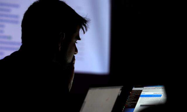 A man takes part in a hacking contest during the Def Con hacker convention in Las Vegas
