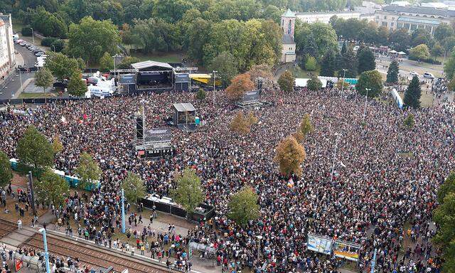 People attend an open air 'anti-racism concert' in Chemnitz