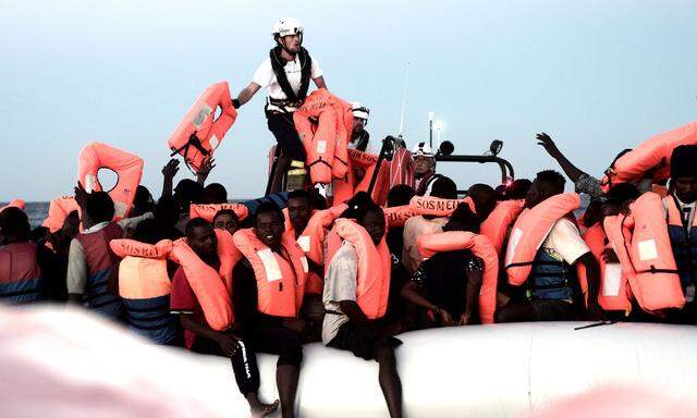 Migrants are rescued by staff members of the MV Aquarius, a search and rescue ship in the central Mediterranean Sea