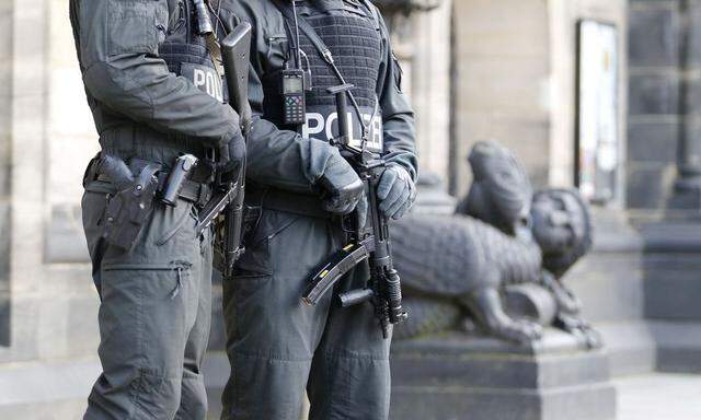 Armed police officers guard 'St. Petri Dome,' next to the town hall of the northern German city Bremen