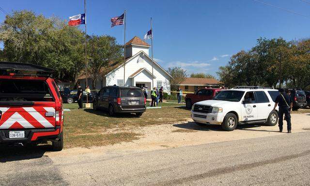 The area around a site of a mass shooting is taped out in Sutherland Springs