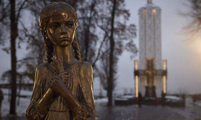 November 26, 2022, Kyiv, Ukraine: The Bitter Memory of Childhood statue honoring the victims of the Holodomor famine on