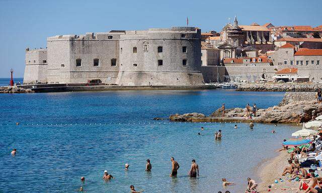 FILE PHOTO: People are seen at Banje beach in Dubrovnik