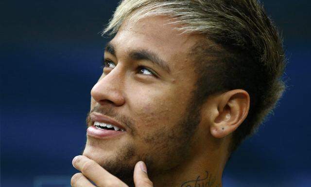 Brazil´s Neymar is seen on the bench before the start of their 2014 World Cup third-place playoff against the Netherlands at the Brasilia national stadium in Brasilia