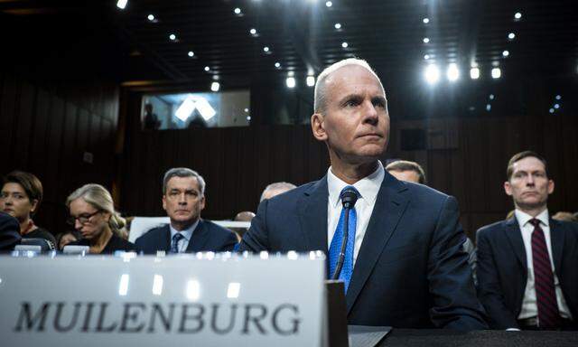 Dennis Muilenburg, CEO of Boeing, prepares to testify during the Senate Commerce, Science and Transportation Committee